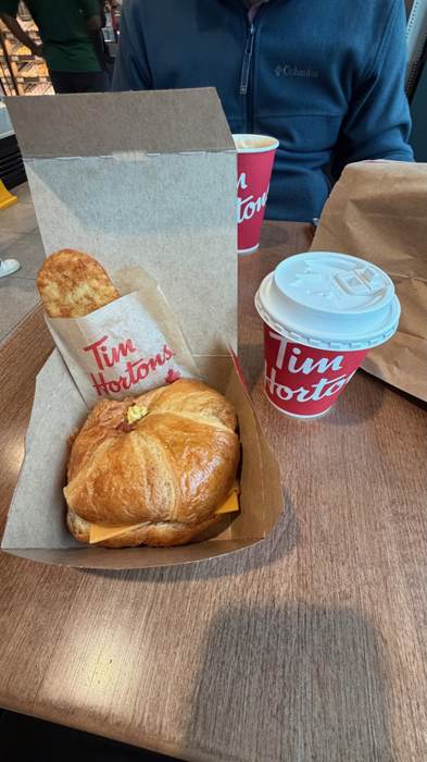 Croissant sandwich with coffee